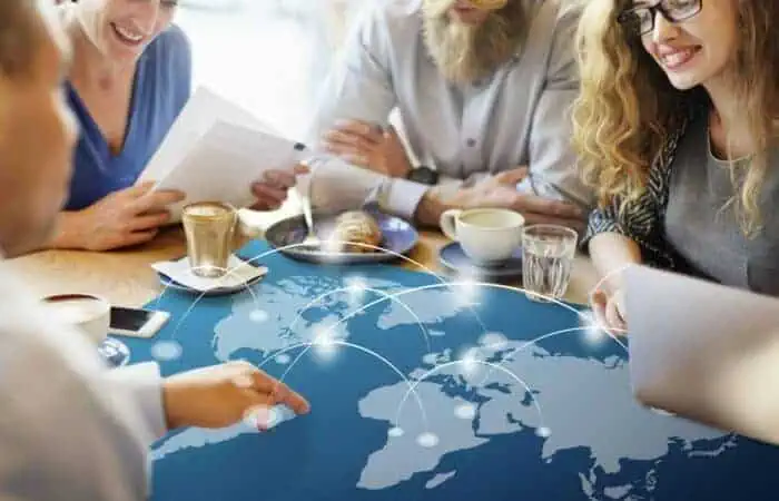 People having a discussion about a world map
