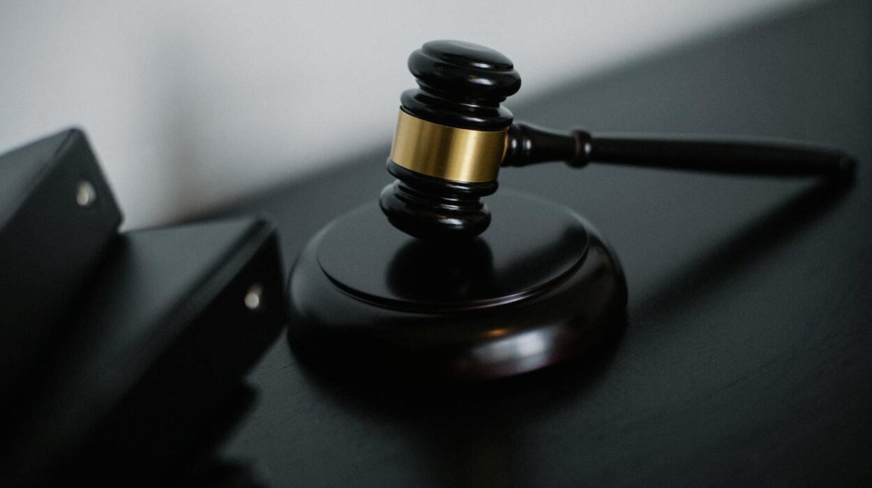 Close-up of a wooden gavel on a desk, symbolizing justice and legal authority.