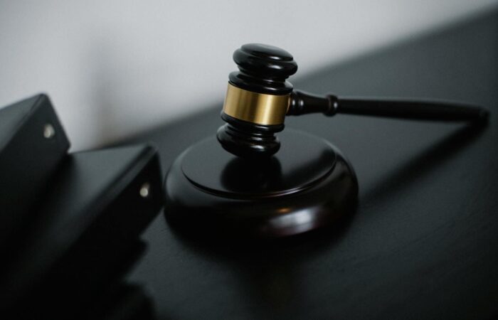 Close-up of a wooden gavel on a desk, symbolizing justice and legal authority.