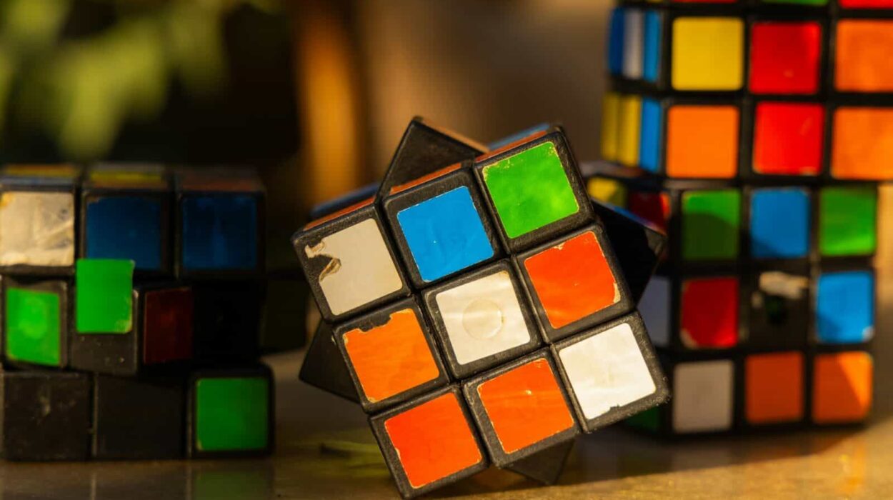 a group of colorful rubik cubes sitting on top of a table